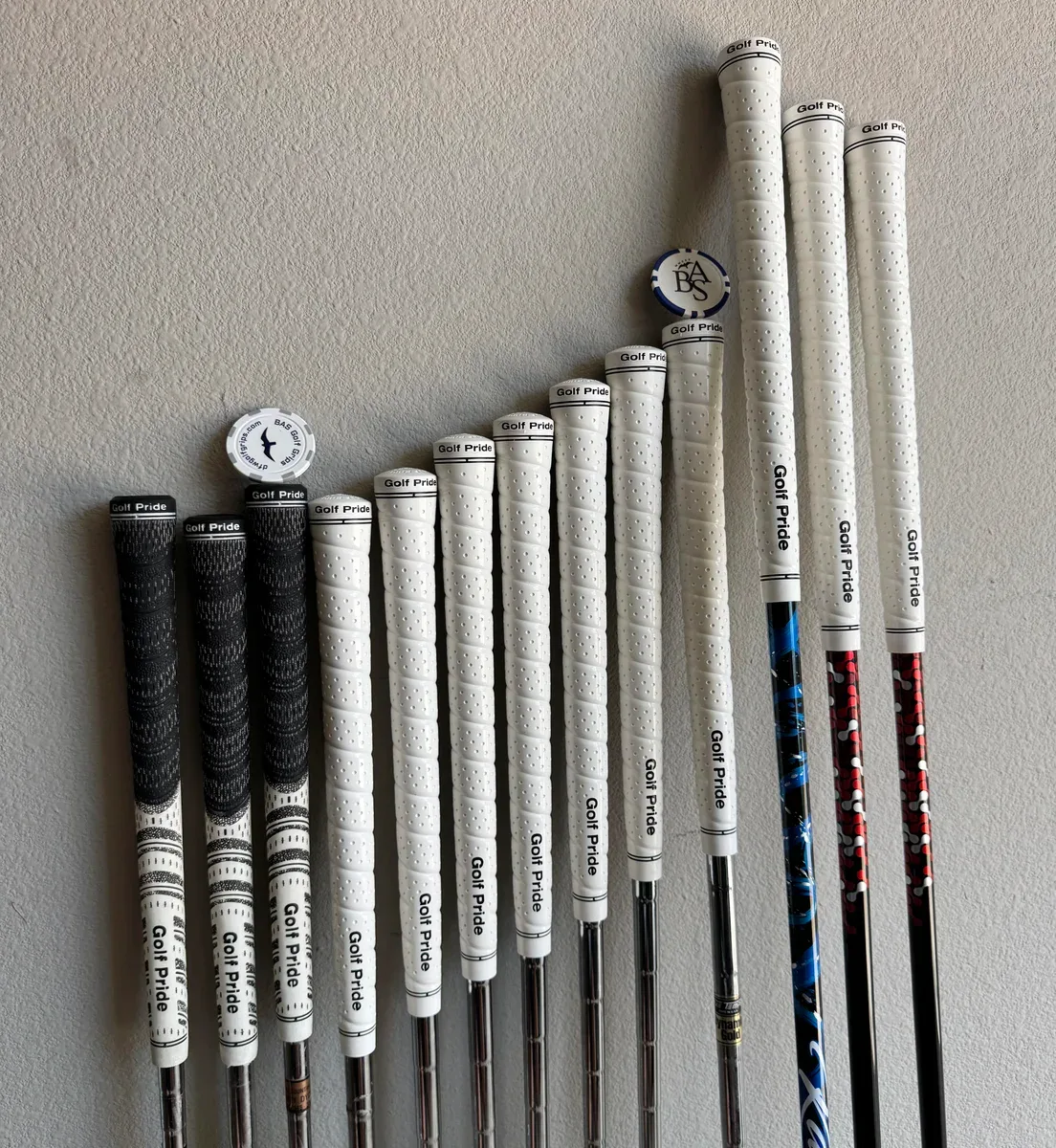 Finished black and blue Golf Pride grips installed by BAS Golf