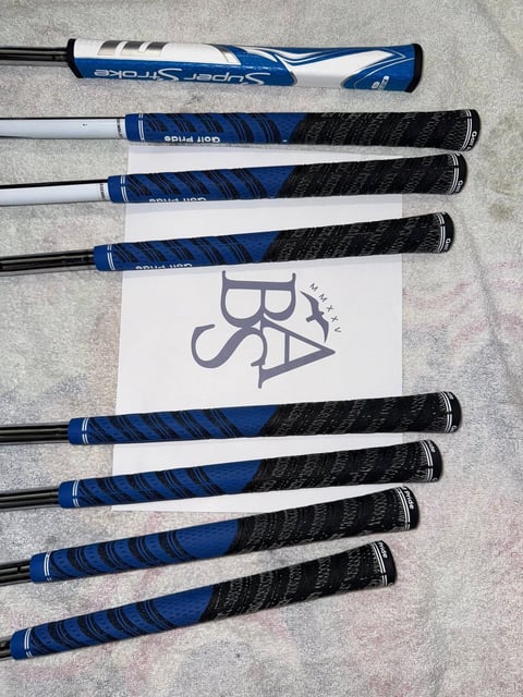 Collection of baseball bats with black textured grips with BSA sports logo